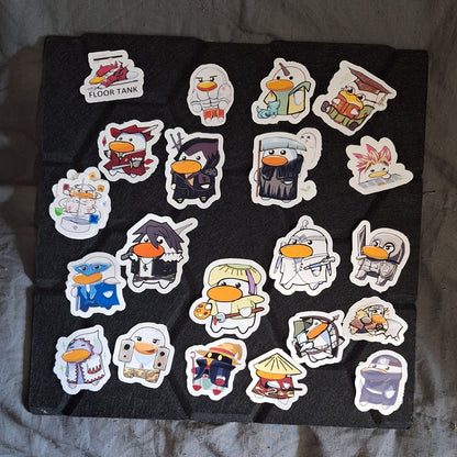 Collection of colorful stickers on a black sheet with a blurred background